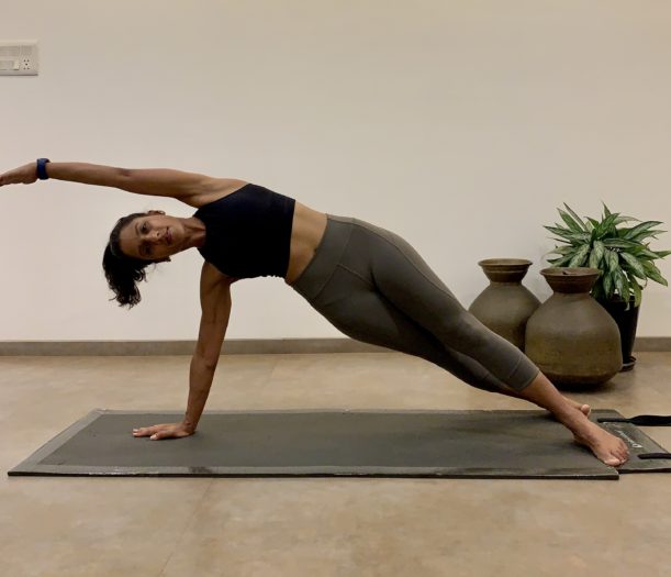 Fitness woman doing yoga. Woman in Eka Pada Rajakapotasana posture. Mermaid  pose Stock Photo by borodai